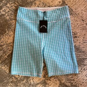 The Upside blue and white NWT bike shorts